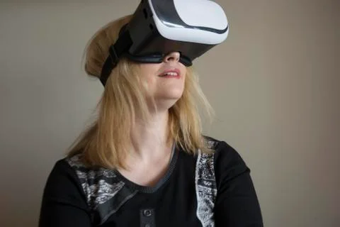 Woman using VR headset Stock Photos