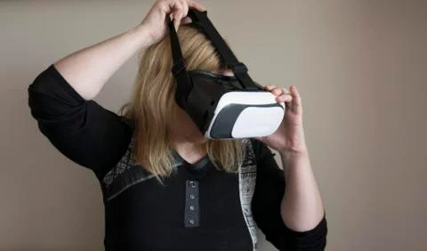 Woman using VR headset Stock Photos
