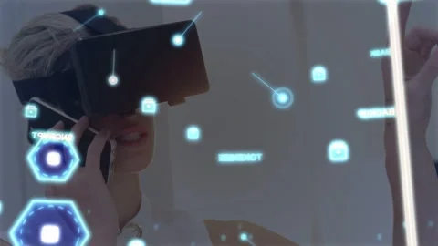 Woman using VR HMD raising finger and initiating AR interface holding phone, Stock Footage 333287982