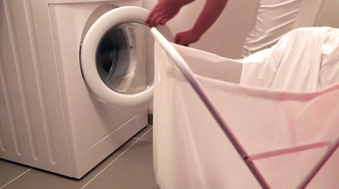 Woman using washing machine Stock-Footage 53233307