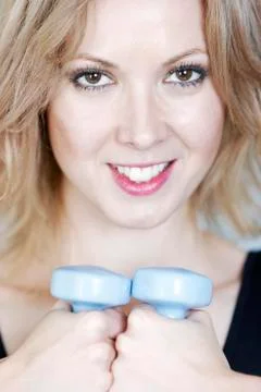 Woman using weights Stock Photos