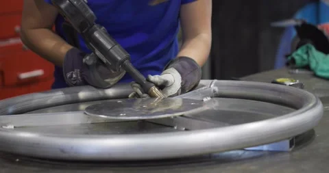 Woman Using a Welding Tool Stock Footage 200790196