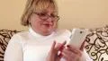 Woman using white smartphone HD Footage