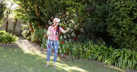 Woman using white VR headset reacting to left hologram, manipulating binary Stock Footage 321452644
