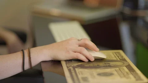 Woman using wireless stylish mouse with her hand in close up. Woman scrolling Stock-Footage 111927592