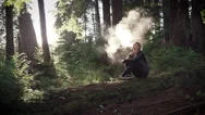 Woman Vaping Electronic Cigarette In Forest Stock Footage