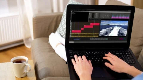 Woman with video editor program on laptop at home Stock Footage 108735910