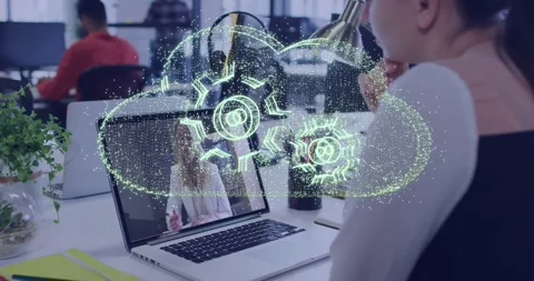 Woman viewing laptop for work, data pulsing forming gear cloud over display Stock Footage 329611404