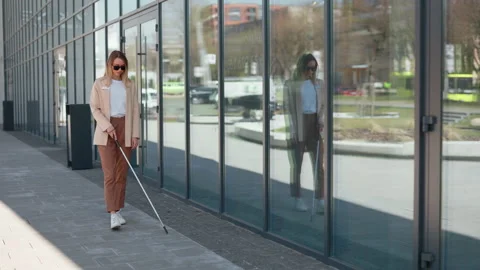 Woman with visual disability using cane stick for walking Stock Footage 198116916