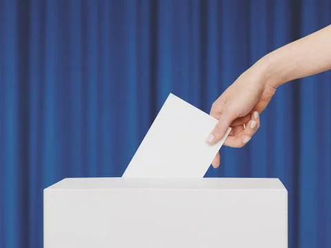 Woman Voter Puts Ballot In Voting Box Stock Photos
