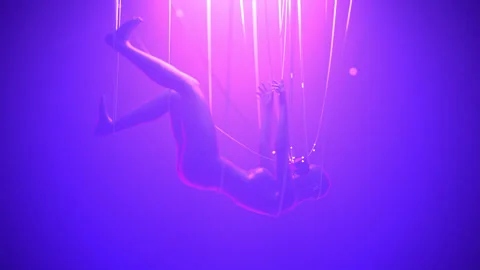 Woman in VR glasses hang on cables in neon space data flow into her. Metaverse 库存影片 164720053