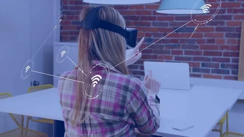 Woman with VR headset gesturing, dim Wi-Fi icon appearing and expanding holo Stock Footage 335281690