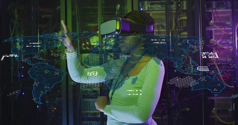 Woman in VR headset gesturing in server room, activating virtual map nodes while Stock Footage 334114398