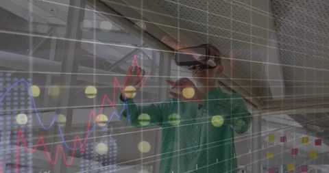 Woman in VR headset interacts with virtual finance tech in modern office. Stock Footage 327450297