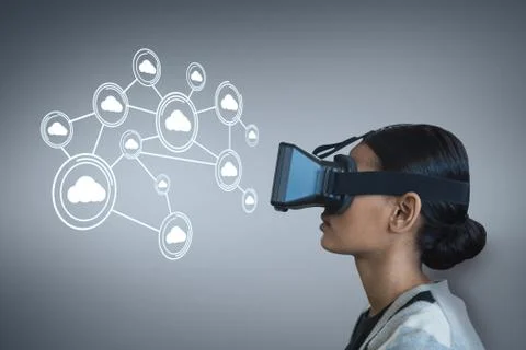 Woman in VR headset looking at interface against purple background Stock Photos