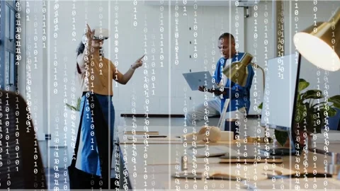 Woman in VR making gestures starting binary overlay in office, man viewing Stock Footage 330141895