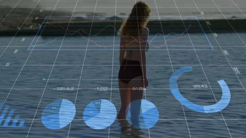 Woman wading and pausing while gazing breakwater activating holo chart grid Stock-Footage 311585946