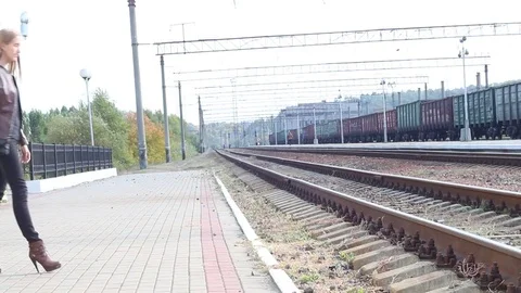 Woman waiting train on the platform Stock Footage 77076977