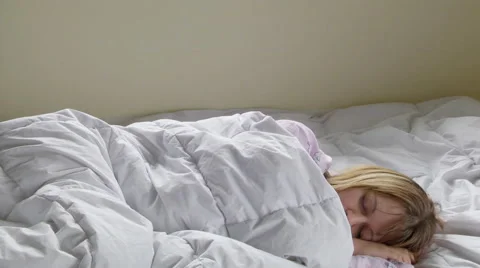 Woman waking up in bed Stock Footage 46721209