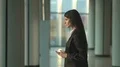 The woman walk and phone in the business center. Slow motion 4k or 4k+ Resolution