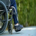 The woman walk with a disabled on the wheelchair. Slow motion 4k or 4k+ Resolution