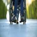 The woman walk with a disabled on a wheelchair. Slow motion 4k or 4k+ Resolution