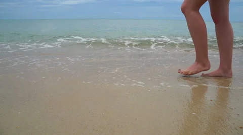 Woman walking on the beach Stock Footage 44001075