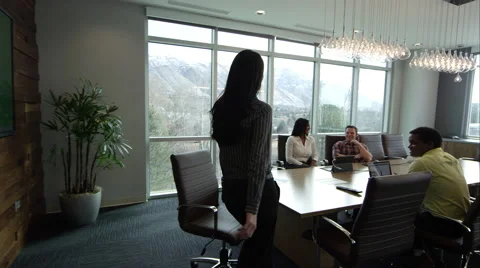 Woman walking into conference room. Stock Footage