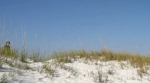 Woman Walking Down Dune Stock Footage 8679340
