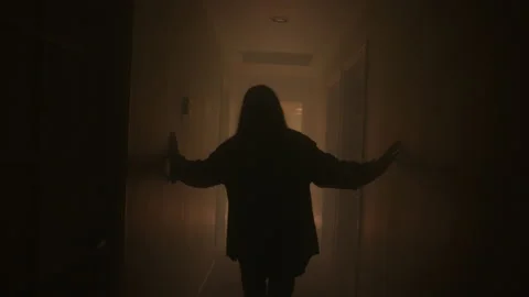 Woman Walking Down An Eerie Hallway | Stock Video | Pond5