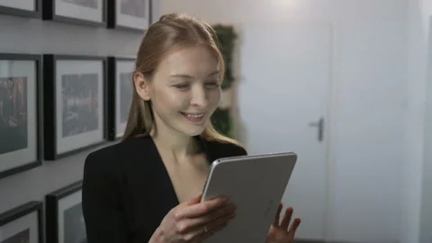 Woman Walking During a Nice Tablet Skype Conversation Stock Footage 86233187