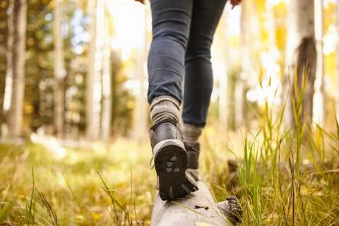Woman walking on log, low section, Flagstaff, Arizona, USA Stock Photos