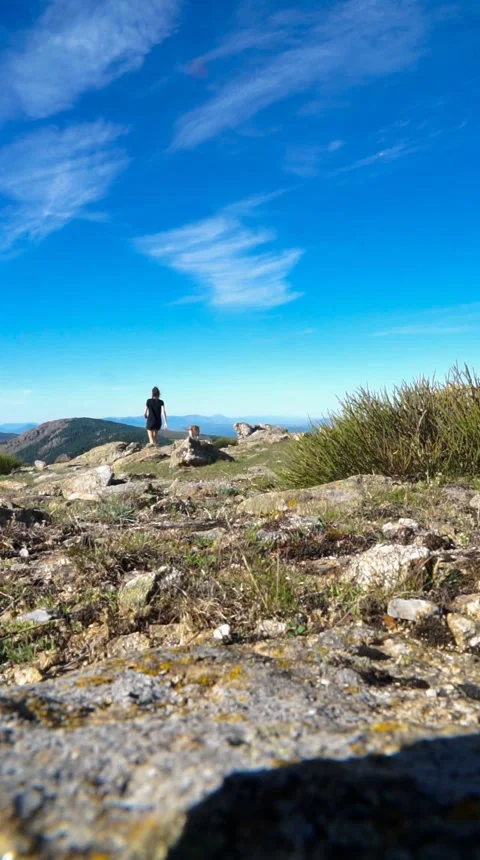 Woman walking in the mountain alone Stock Footage 252191320