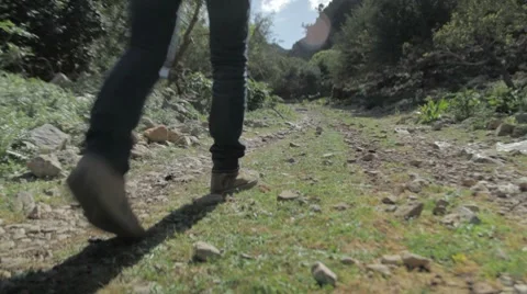 Woman walking on path Stock Footage 7747993