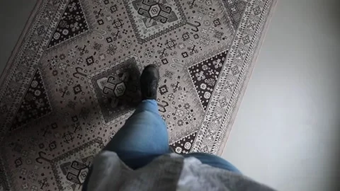 Woman walking on Persian rug Stock Footage