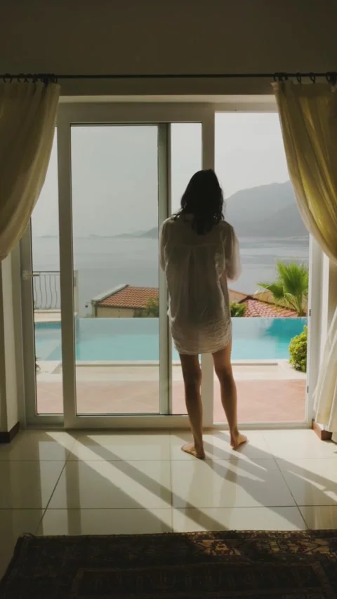 Woman Walking to Poolside View Through Glass Door Stock Footage 326770220