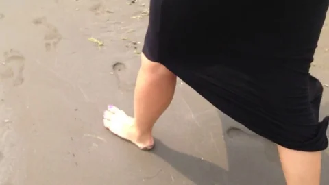 Woman walking on the sand Stock Footage 80503301