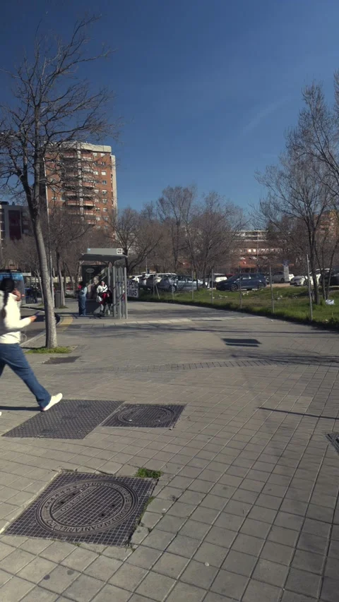 Woman walking on sidewalk using smartphone in the city Stock-Footage 329510168