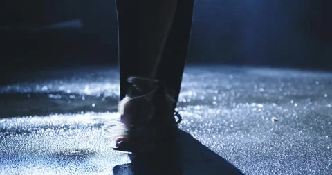 woman walking on wet street at night in ... | Stock Video | Pond5