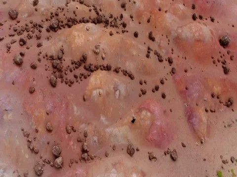 Woman walks in colorful desert Stock Footage