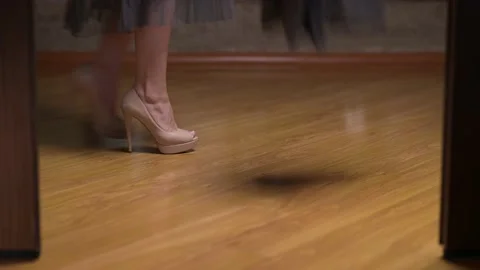 A woman walks home, casually undressing ... | Stock Video
