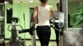 Woman walks on treadmill in the gym. Exercising in gym, treadmill cardio workout HD Footage