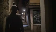 Woman Wandering In Dark Alleyway At Night Stock Footage