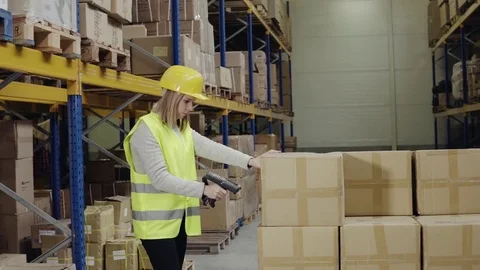 Woman warehouse worker with barcode scanner. Stock Footage