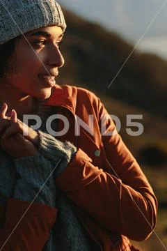 Woman in warm wear looking away Stock Photos