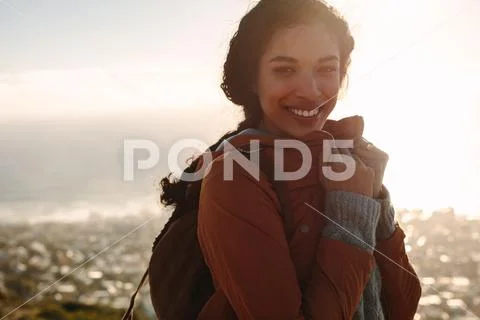 Woman in warm wear smiling at camera Stock Photos