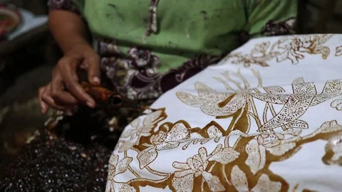A woman was do batik work with traditional techniques. canting. HD Stock Footage 131699171