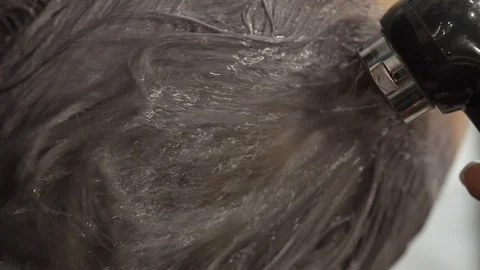 Woman wash head with shower while doing head massage Stock Footage 124705657