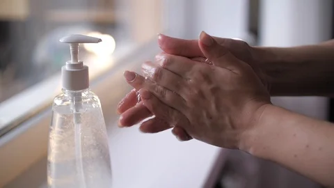 Woman washes hands by soap while coronavirus carantin to prevent infection Stock Footage 126479009