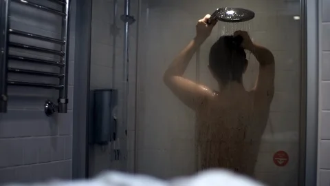 A woman washes her head Slow motion. Stock Footage 123966853
